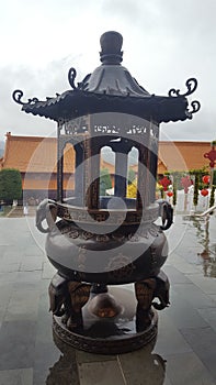 Incense holder statue at Nan Tien Buddhist Temple at Unanderra, close to Wollongong, NSW, Australia