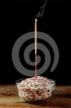 Incense is lit on the rice field perform ritual worship