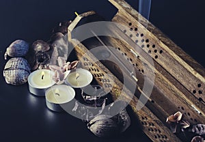 Incense stick aroma with smoke  in a  holder with dried petals