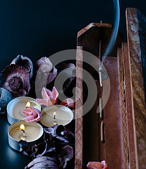 Incense stick aroma with smoke  in a wooden handmade holder