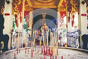 Incense stick burning,Thai Buddhists use incense to worship Buddha, Scenery background of the incense and faithful