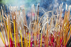 Incense sticks at the buddhist temple burning ritual