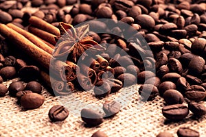 Incense sticks of cinnamon asterisk star anise anise and grains of roasted coffee