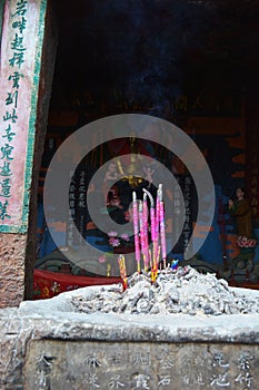 Incense sticks in the incense burner at the temple.