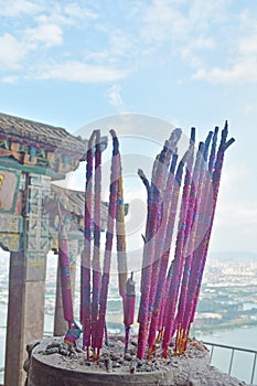 Incense sticks in the incense burner at the temple.