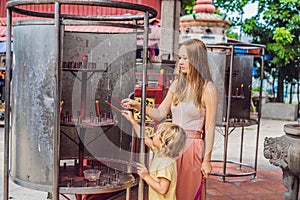 Incense sticks on joss stick pot are burning and smoke use for pay respect to the Buddha, Incense sticks in Mother and