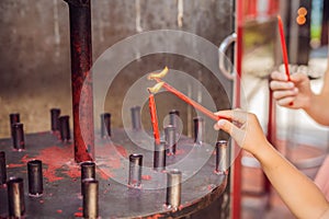 Incense sticks on joss stick pot are burning and smoke use for pay respect to the Buddha, Incense sticks in Mother and