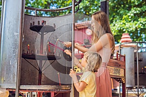 Incense sticks on joss stick pot are burning and smoke use for pay respect to the Buddha, Incense sticks in Mother and