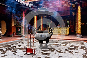 Incense sticks in large vase and large incense sticks at the foreground in Ong Bon Pagoda, Cho Lon Ho Chi Minh City, Vietnam