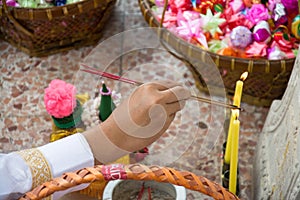 Incense sticks to pray in ordination ceremony for man becoming a new monk or priest