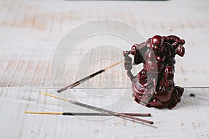 Incense on a white wooden background