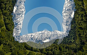Inception effect. Manipulation. Cloudy sky, mountains and trees..