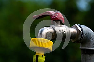 3, 4 inch garden water tap with yellow hose