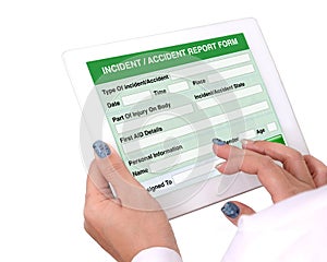 Incident or accident report form on tablet computer. photo
