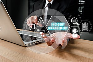 Incident Managementconcept, Business person hand holding incident management icon on virtual screen