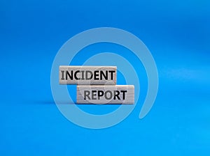 Incident Report symbol. Concept word Incident Report on wooden blocks. Beautiful blue background. Business and Incident Report
