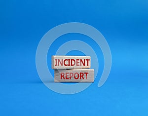 Incident Report symbol. Concept word Incident Report on wooden blocks. Beautiful blue background. Business and Incident Report