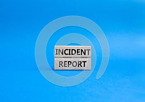 Incident Report symbol. Concept word Incident Report on wooden blocks. Beautiful blue background. Business and Incident Report