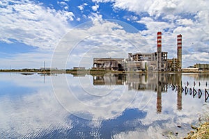 Incinerator with chimneys close to a lagoon