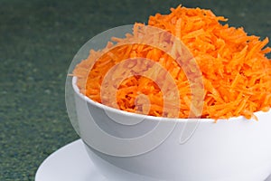 Incised carrots on white background