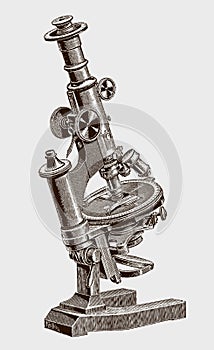 Inclinable optical microscope with a revolving stage for mineralogical research photo