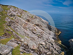 Inclined rock strata near the Eilean Glas Lighthouse on Scalpay - Outer Hebrides Thrust Zone Mylonites Complex - Mylonite. photo