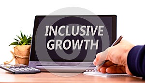 Inclusive growth symbol. Concept words Inclusive growth on beautiful black tablet. Beautiful white background. Calculator.