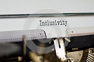 Inclusivity and belonging symbol. The word `inclusivity` typed on retro typewriter. Business, inclusivity and belonging concept.