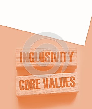 Inclusivity and core values words written on wooden blocks. Social and business concept