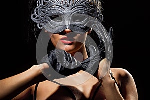 Incognito woman in ancient style mask