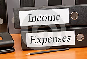 Income and Expenses, two binders in the office