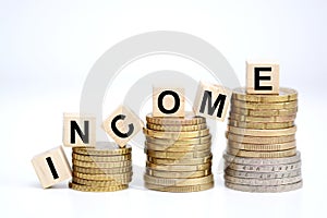 Income increase concept with upward pile of coins