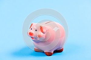 Income management. financial problem. piggy bank on blue background. planning budget. money saving. Bank collector