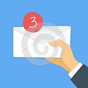 Income message in email concept. Hand holding envelope