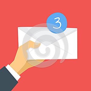 Income message in email concept. Hand holding envelope