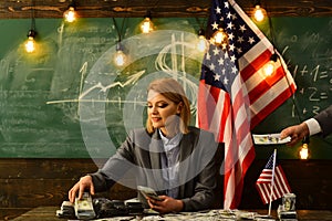 Income planning of budget increase policy. income concept with woman at american flag.