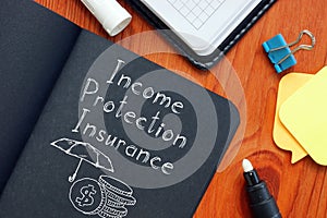 Income protection insurance is shown using the text and picture of umbrela