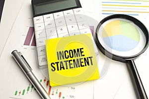 INCOME STATEMENT text on the yellow card on the chart background