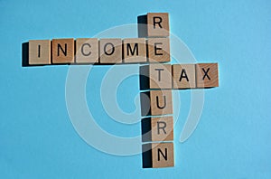 Income Tax Return Crossword on blue