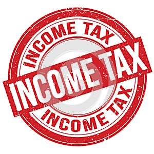 INCOME TAX text written on red round stamp sign