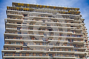 Incomplete building construction with scaffolding detail