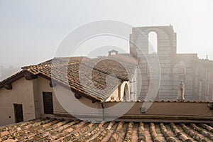 Incomplete facade of the planned Duomo nuovo or Facciatone in fog. Siena. Tuscany Italy.