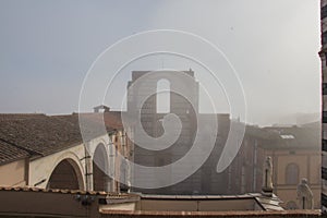 Incomplete facade of the planned Duomo nuovo or Facciatone in fog. Siena. Tuscany Italy.