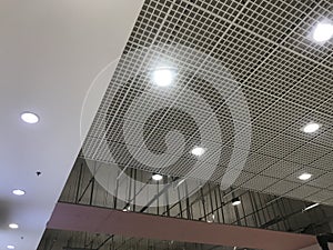 Incomplete Gypsum and macro grid ceiling under progress in an Shopping mall due to snag list