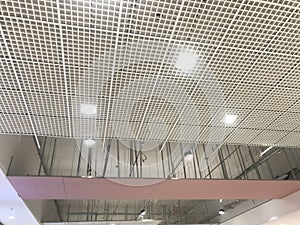 Incomplete Gypsum and macro grid ceiling under progress in an Shopping mall due to snag list