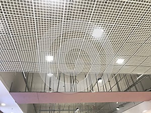 Incomplete Gypsum and macro grid ceiling under progress in an Shopping mall due to snag list