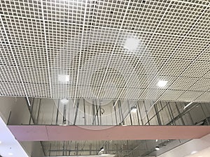 Incomplete Gypsum and macro grid ceiling under progress in an Shopping mall due to snag list