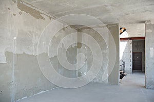 Incomplete plastering house room renovation and remodeling with doorway photo