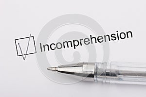 Incomprehension - checkbox with a cross on white paper with pen. Checklist concept photo