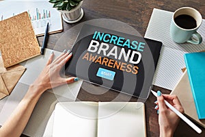 Increase brand awareness text on screen. Advertising and marketing concept